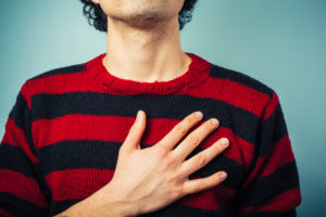 Young man is pledging allegience with his right hand raised